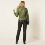 Woman wearing olive green quilted leather jacket styled with black leather pants and black handbag for complete chic outfit - Vanguard Elite Moto Jacket