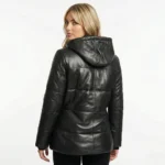 Rear view of black leather puffer jacket showing quilted panel construction and fitted silhouette on woman - Velora Arctic Elite Black Leather Puffer