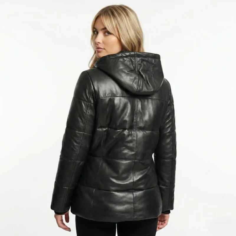 Rear view of black leather puffer jacket showing quilted panel construction and fitted silhouette on woman - Velora Arctic Elite Black Leather Puffer