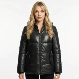 Woman wearing black quilted leather puffer jacket with front zipper closure and side pockets, front facing view of Velora Arctic Elite Black Leather Puffer