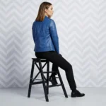 Back view of royal blue leather moto jacket showing center back seam structured shoulders and hip length hem - Velour Rebel Leather Jacket