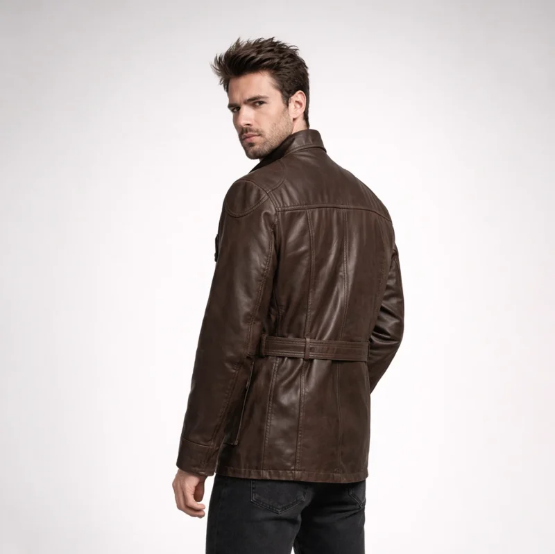 Rear view of brown leather field jacket showing smooth back panel, belted waist, shoulder seam detailing, and hip-length cut