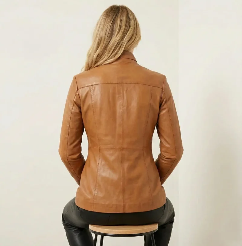 Back view of women’s tan leather Crimson Vanguard Coat showing tailored fit and clean structured back design