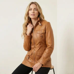 Woman wearing Crimson Vanguard tan leather coat with front zipper, buckle details, and structured fit, front view