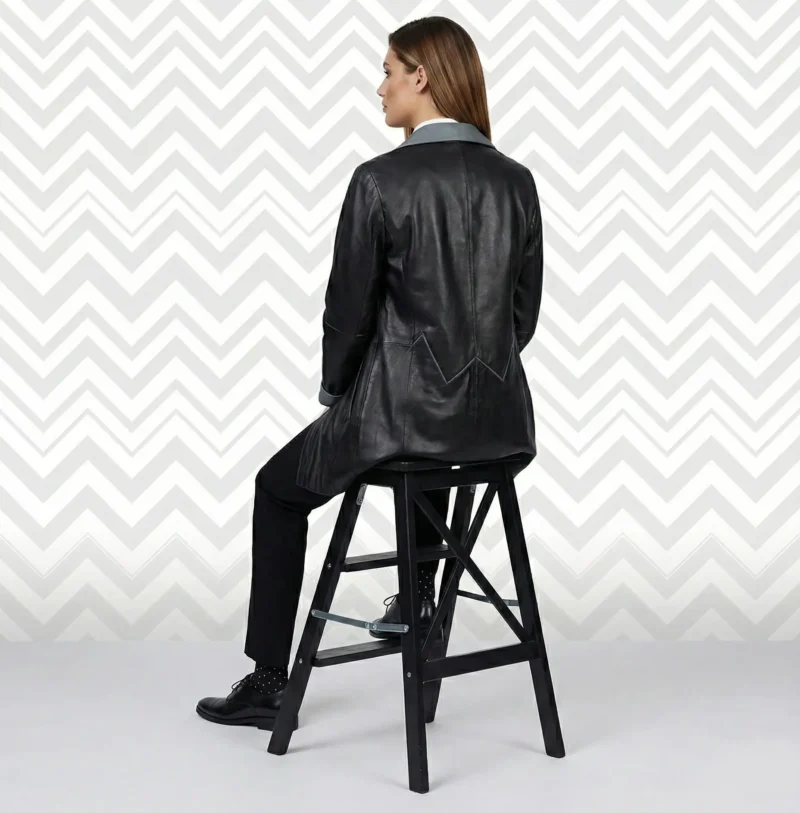 Back view of women’s black leather blazer coat with tailored fit and clean seam detailing