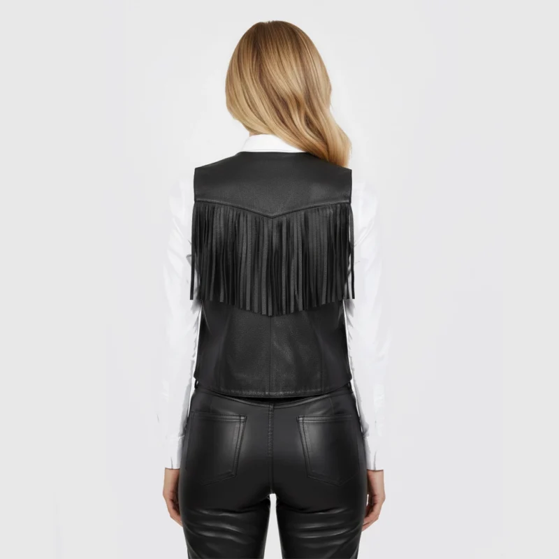 Back view of women’s black leather fringe vest showing smooth leather finish, structured tailoring, and western-inspired design.