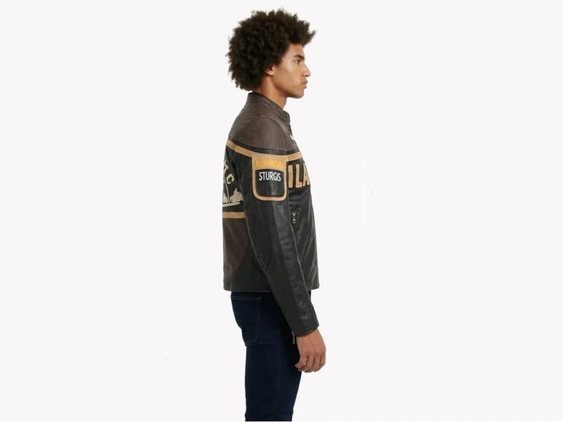 Left side profile of Black Hills Sturgis leather biker jacket showing sleeve patch, brass side zip pocket, tan stripe and two-tone leather silhouette